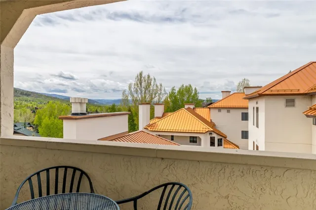 a kitchen that has a sink cabinets counter space and appliances