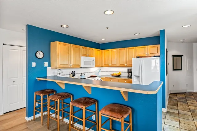 a kitchen with stainless steel appliances a sink stove and cabinets