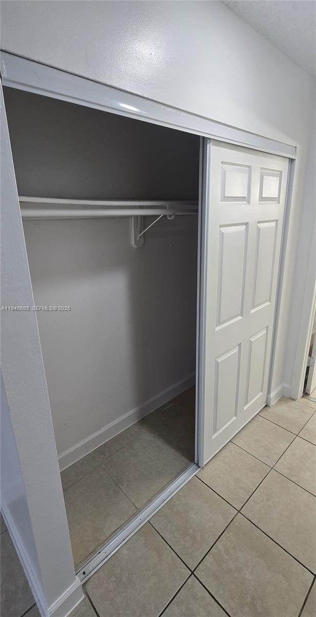11150 Southwest 196th Street, Unit 104 Cutler Bay, FL 33157 - Photo 15 of 18 a view of an empty walk in closet