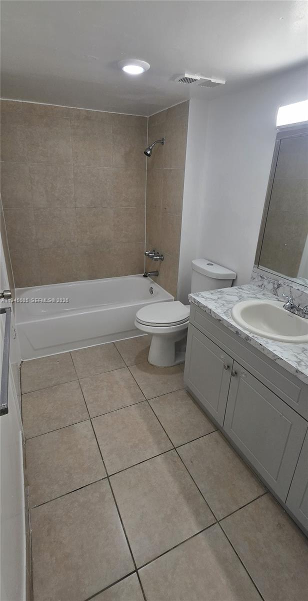11150 Southwest 196th Street, Unit 104 Cutler Bay, FL 33157 - Photo 18 of 18 a bathroom with a sink a toilet and shower