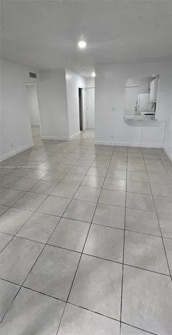 a view of water heater room with wooden floor