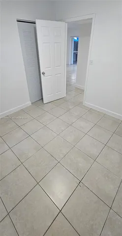 a view of an empty room and entryway