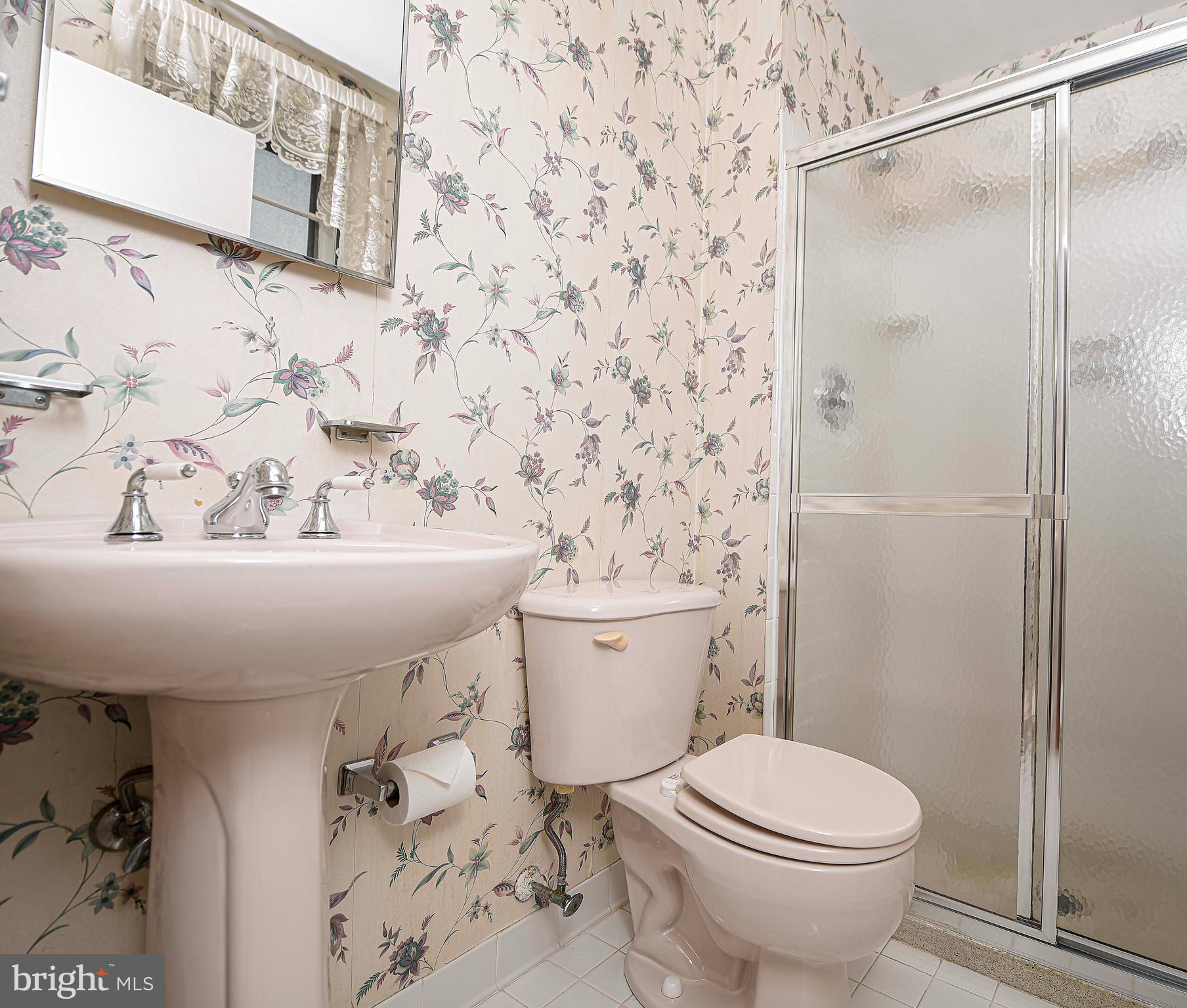 1607 Weyburn Road Rosedale, MD 21237 - Photo 11 of 36 a bathroom with a sink toilet and shower