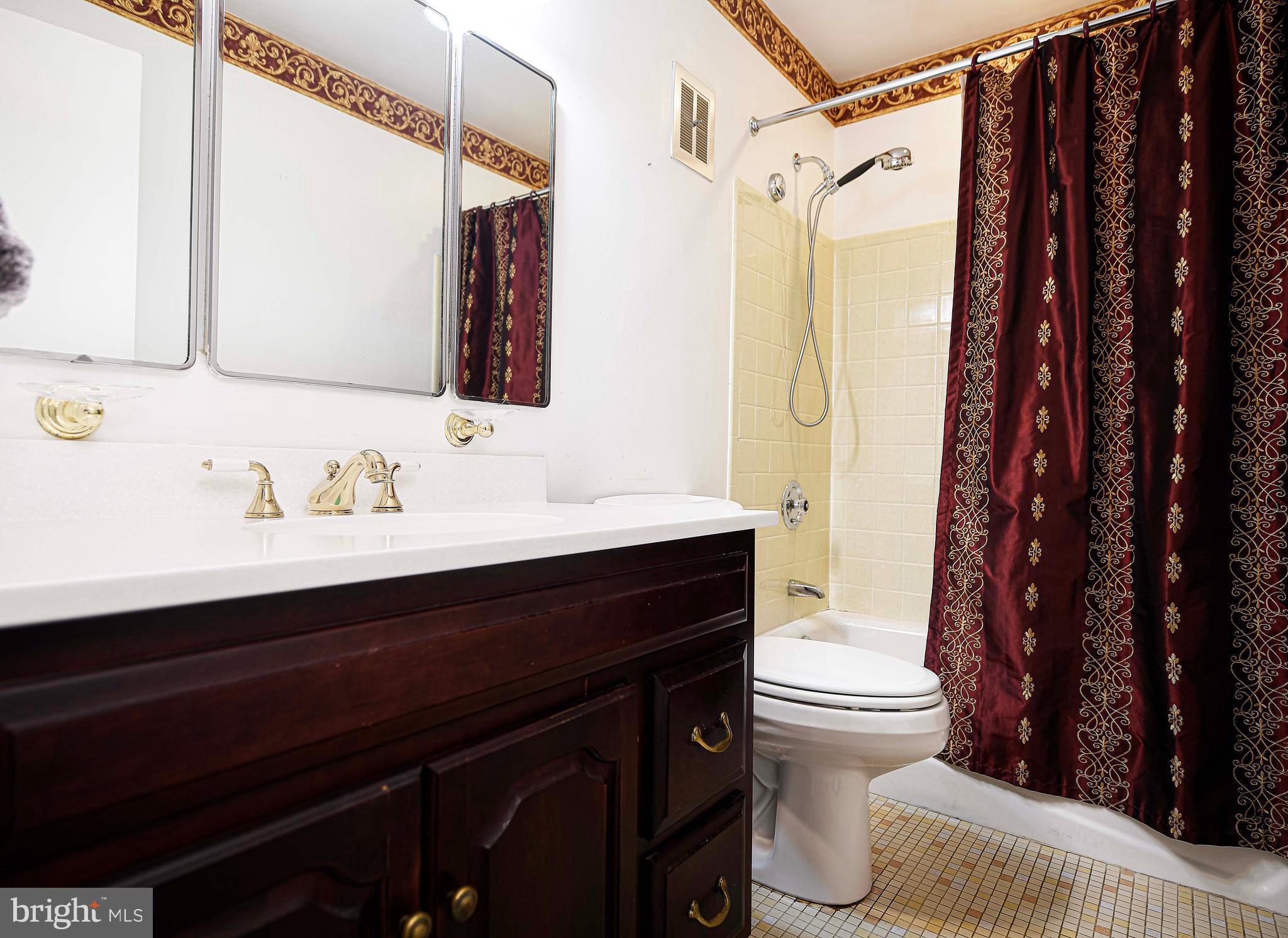 1607 Weyburn Road Rosedale, MD 21237 - Photo 13 of 36 a bathroom with a sink and a mirror