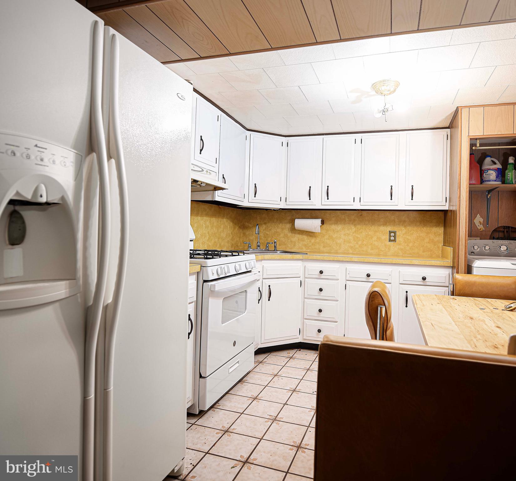 1607 Weyburn Road Rosedale, MD 21237 - Photo 20 of 36 a kitchen with cabinets appliances and a sink