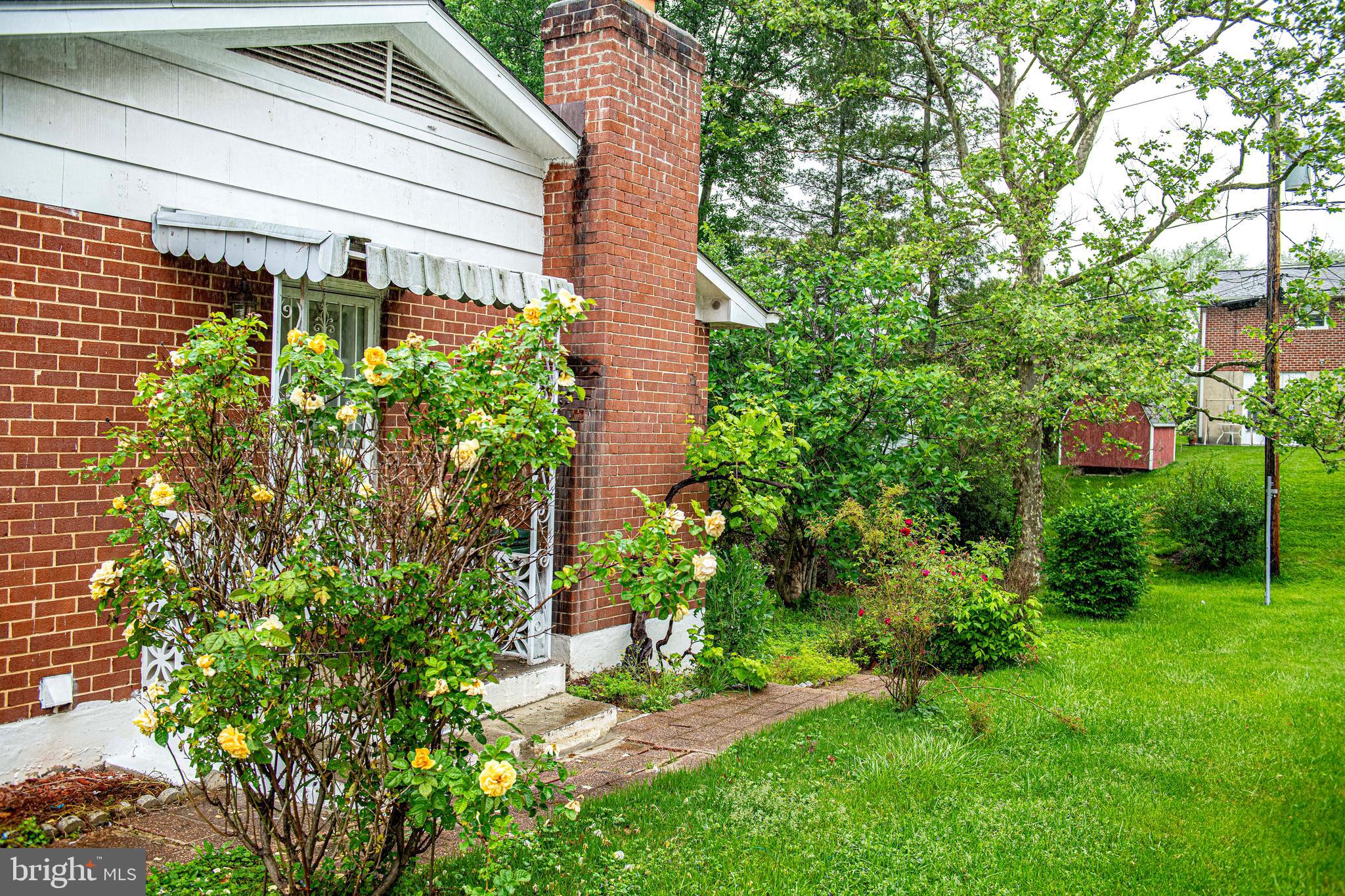 1607 Weyburn Road Rosedale, MD 21237 - Photo 27 of 36 a backyard of a house with plants and outdoor seating