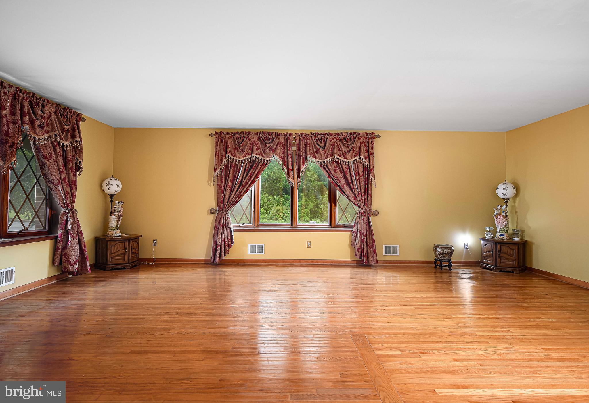 1607 Weyburn Road Rosedale, MD 21237 - Photo 6 of 36 a view of empty room with wooden floor and fan