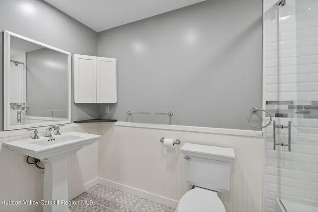 a bathroom with a sink toilet and vanity