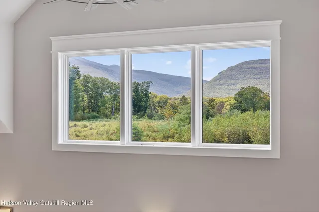 a view of a glass door and a window