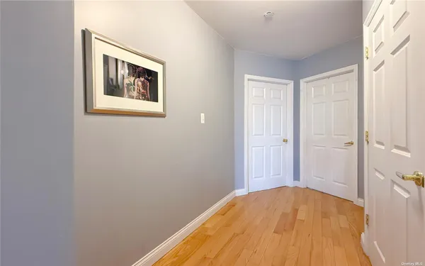 a view of a bedroom with a wooden bed