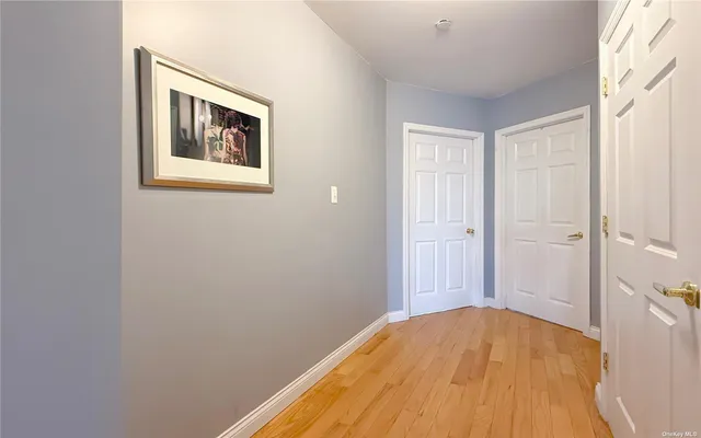 a view of a bedroom with a wooden bed