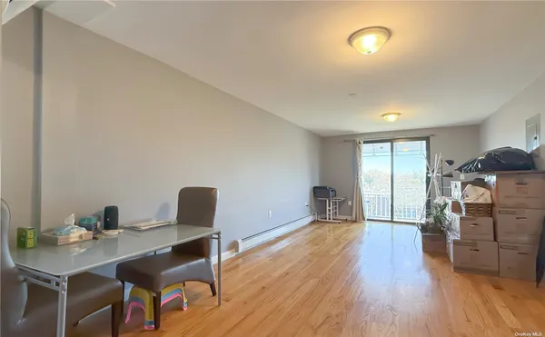 a workspace with furniture hardwood and a window