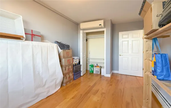 a bed room with a bed and a window