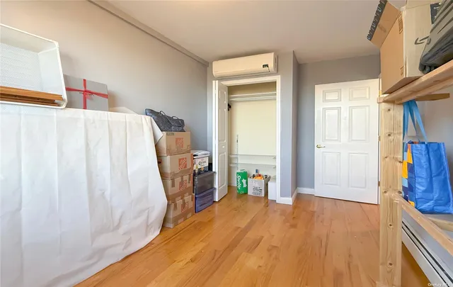 a bed room with a bed and a window