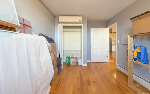 a bed room with a bed and a book shelf
