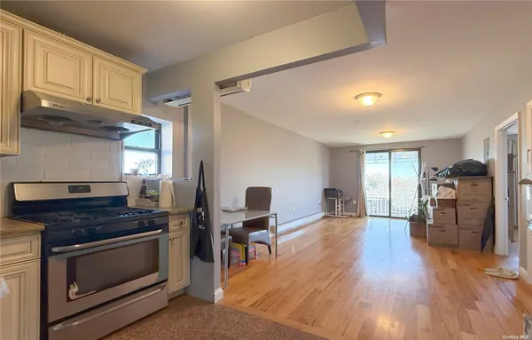 a kitchen with stainless steel appliances granite countertop a stove and cabinets
