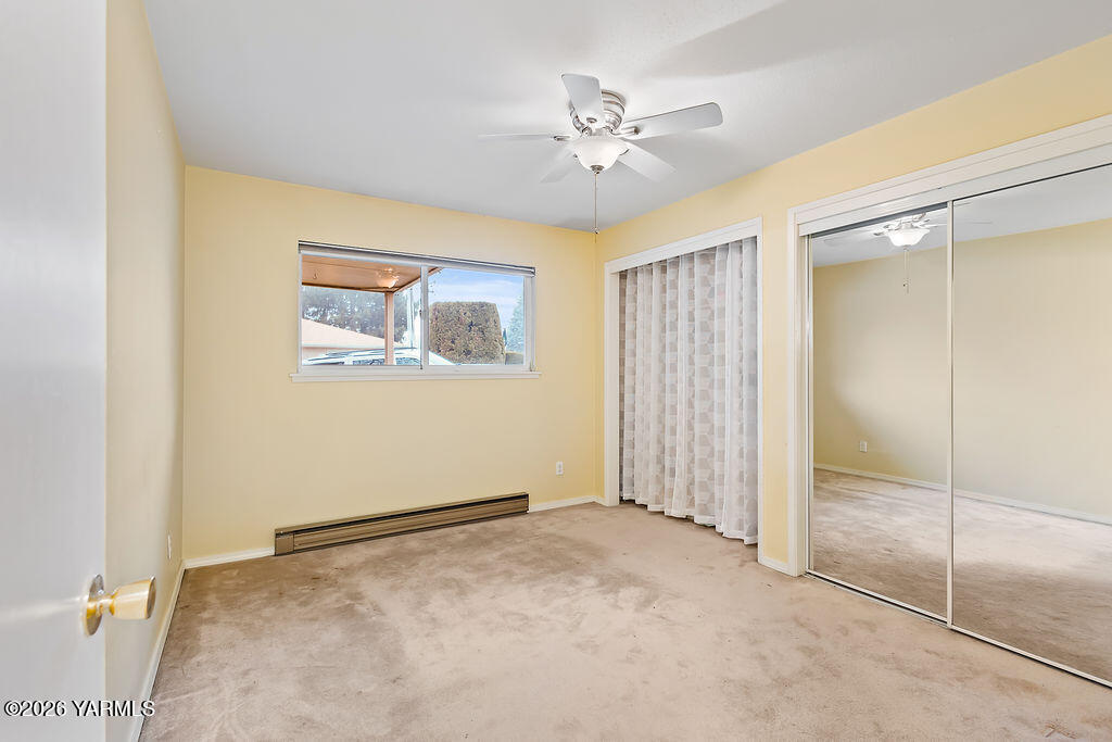 7610 Summitview Avenue, Unit 11 Yakima, WA 98908 - Photo 15 of 20 a view of an empty room with chandelier fan