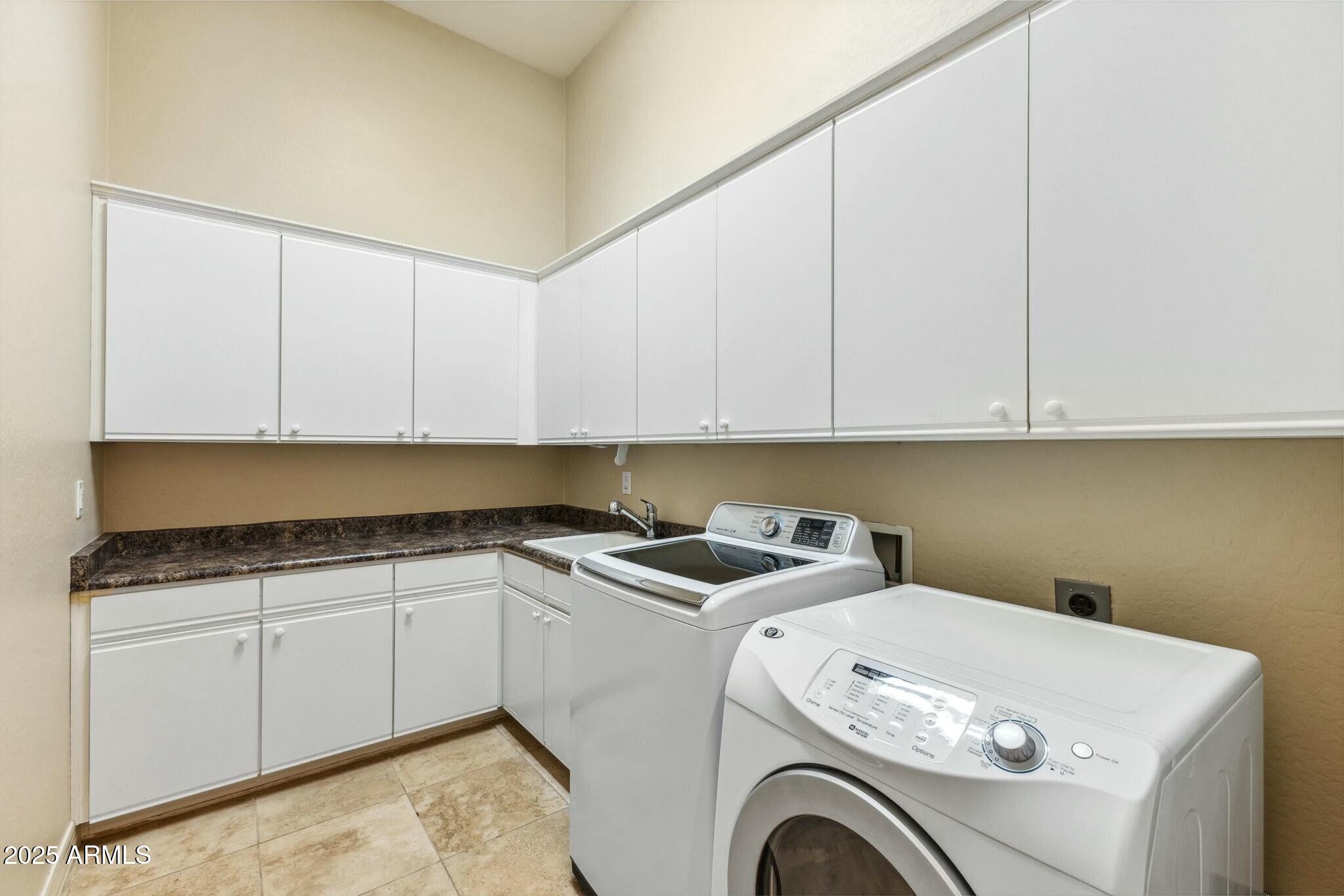 41601 North River Bend Road Anthem, AZ 85086 - Photo 23 of 97 a utility room with dryer and washer