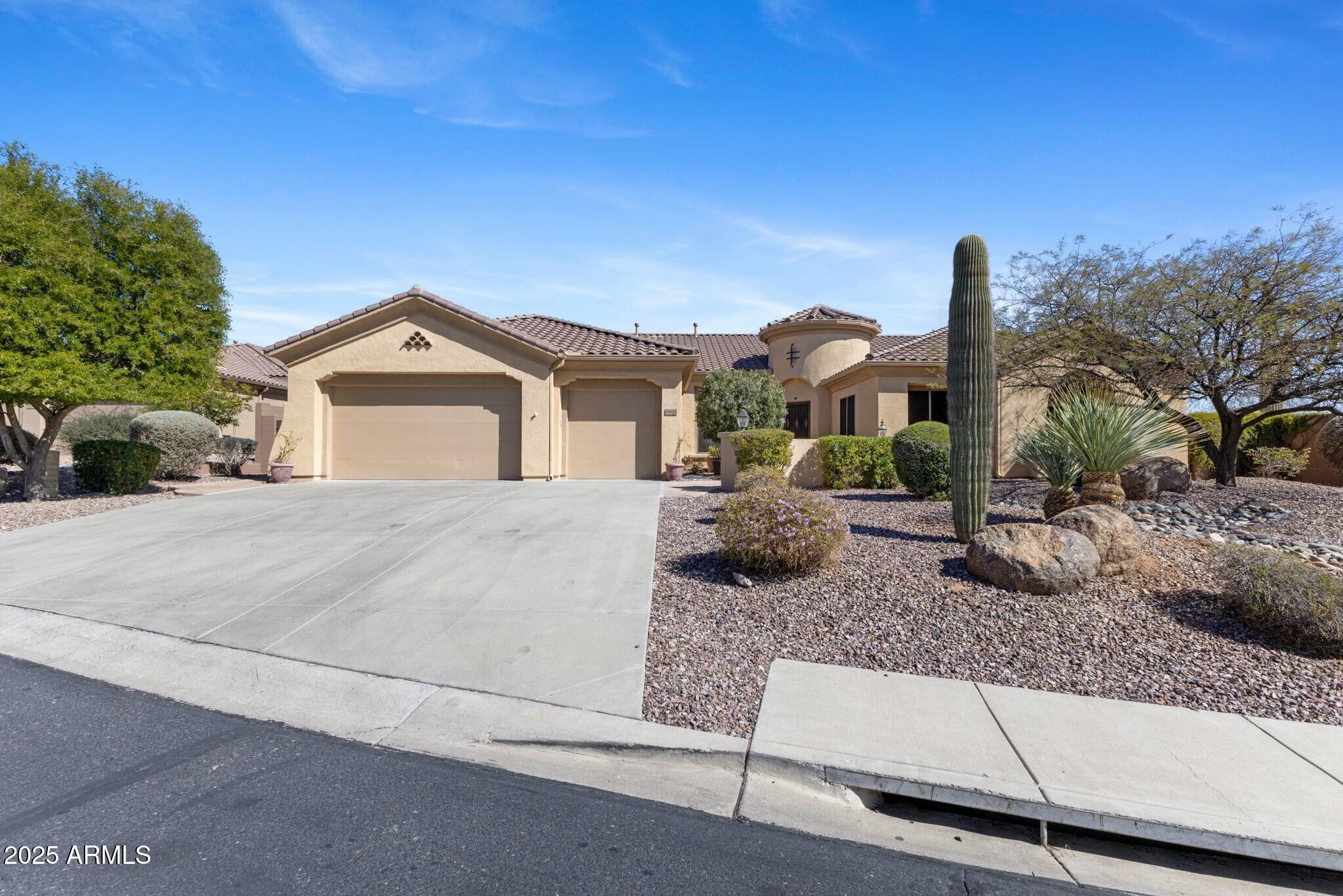41601 North River Bend Road Anthem, AZ 85086 - Photo 27 of 97 a front view of a house with garden