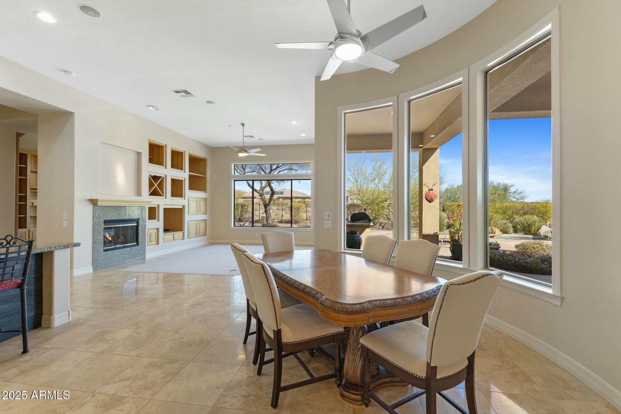 41601 North River Bend Road Anthem, AZ 85086 - Photo 39 of 97 a view of a dining room with furniture window and wooden floor