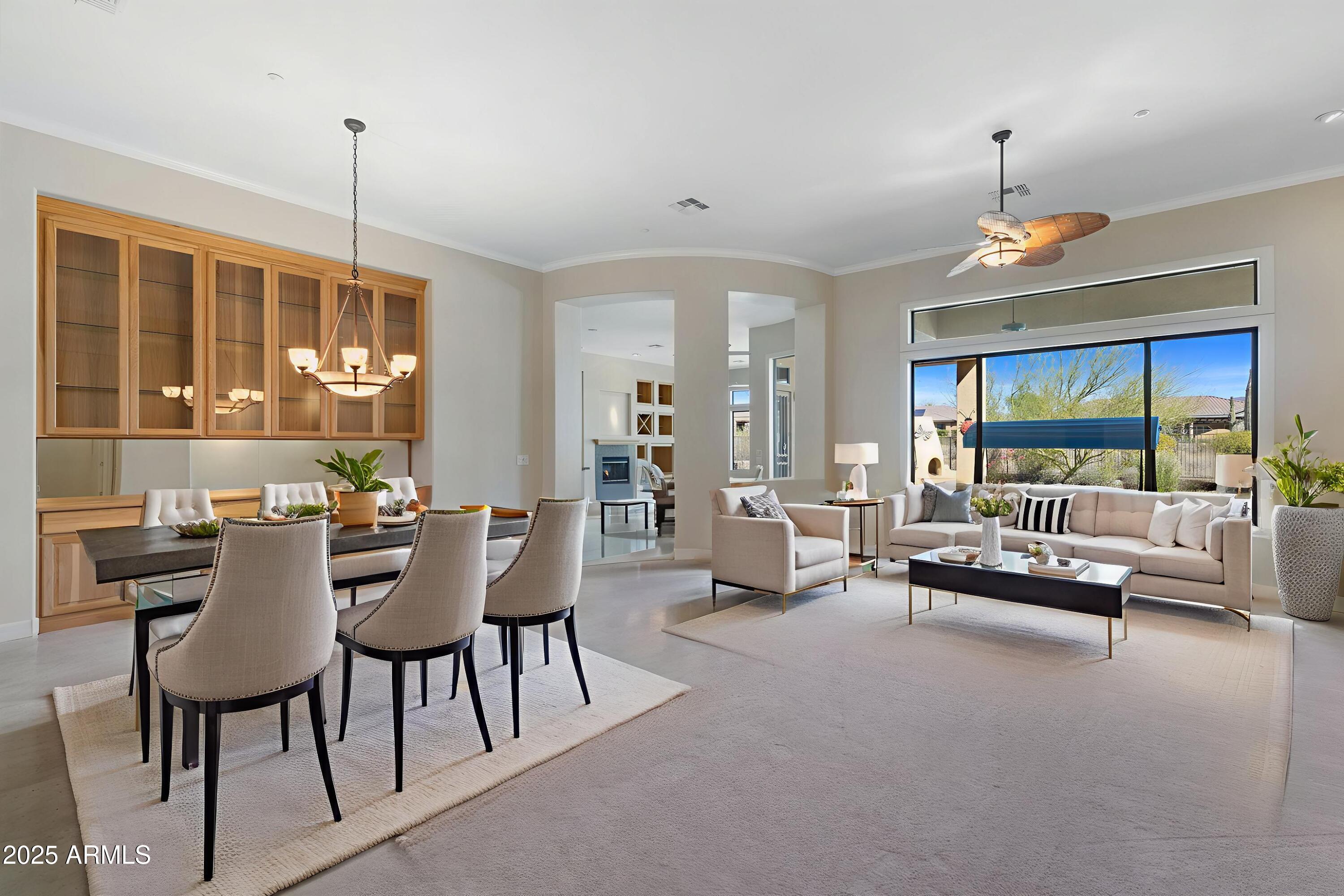 41601 North River Bend Road Anthem, AZ 85086 - Photo 5 of 97 a dining room with furniture wooden floor and a chandelier