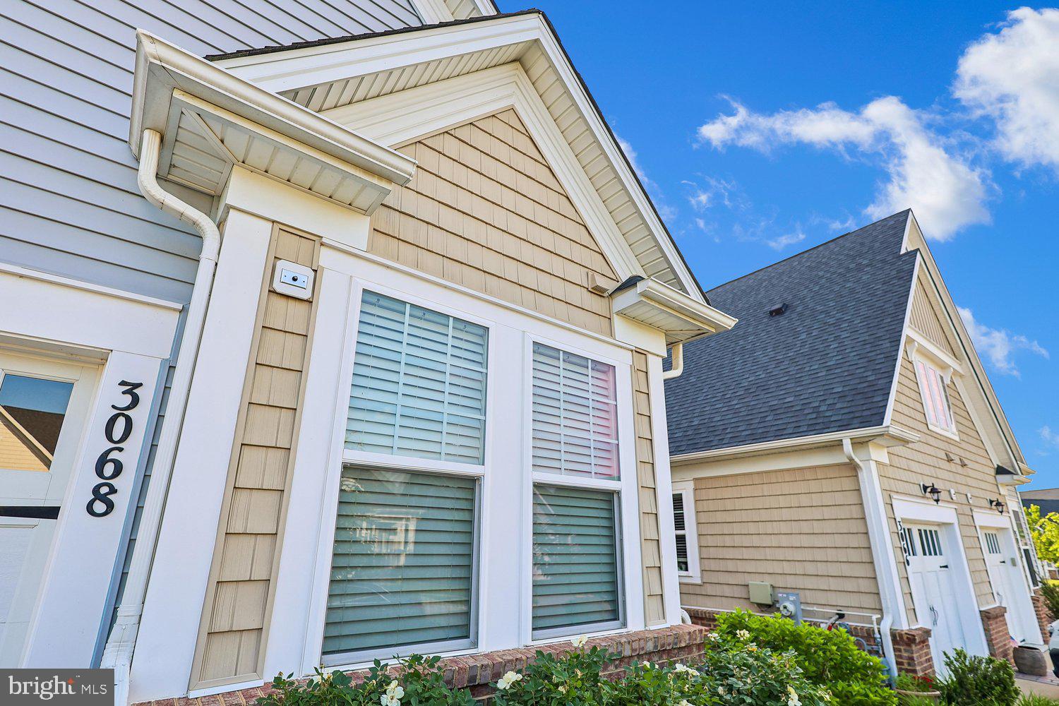 3068 Spring Peeper Court Odenton, MD 21113 - Photo 6 of 29 a view of a house with a garage and balcony