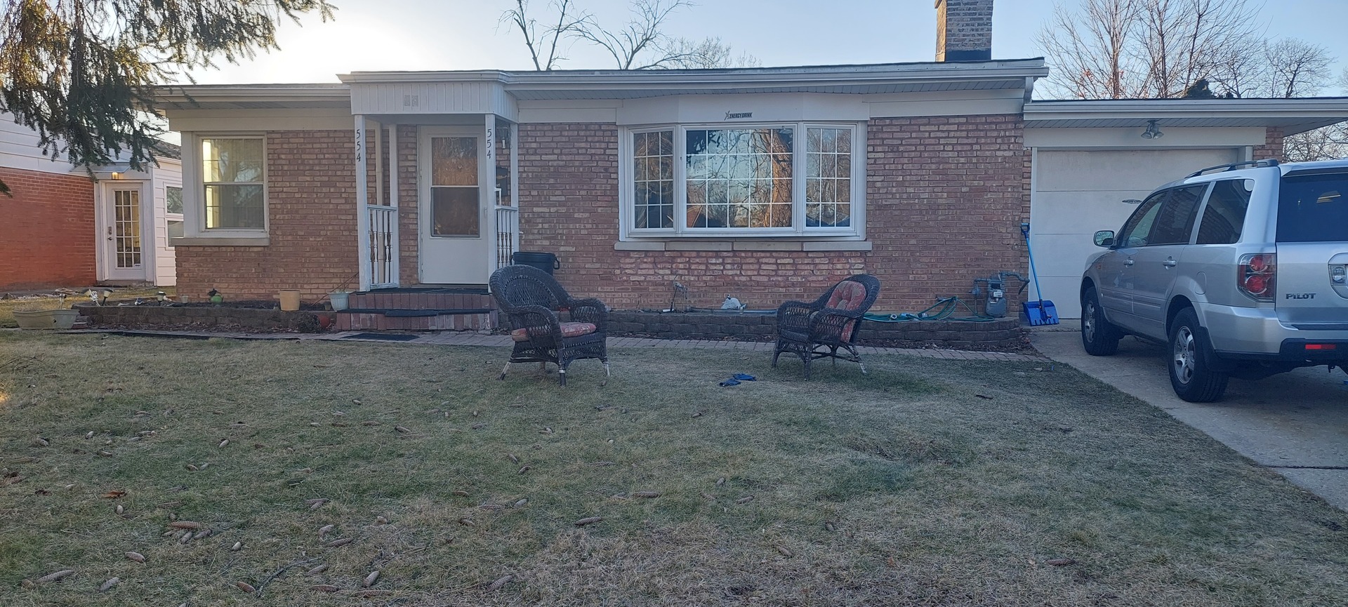a view of house with backyard space and porch