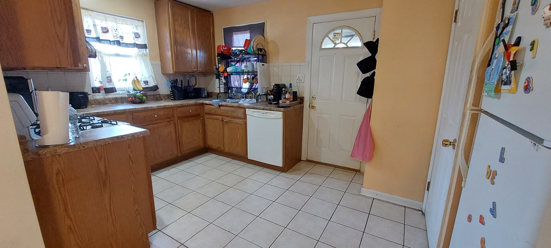 554 South Craig Place Lombard, IL 60148 - Photo 5 of 14 a kitchen with stainless steel appliances granite countertop a refrigerator and a sink