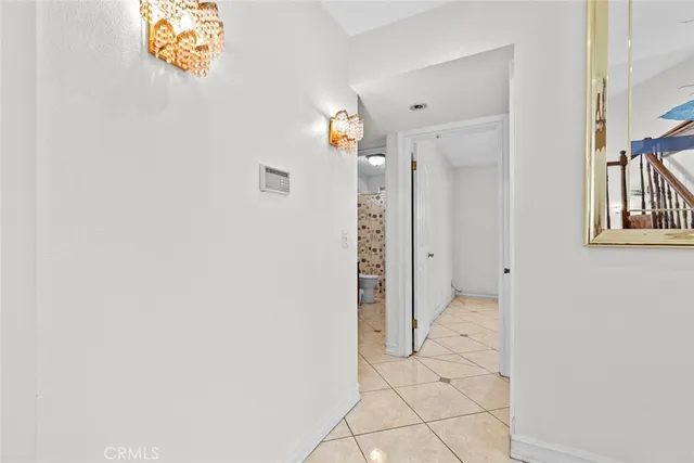 a view of a hallway with paintings on the wall