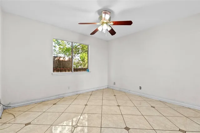 a view of an empty room and window