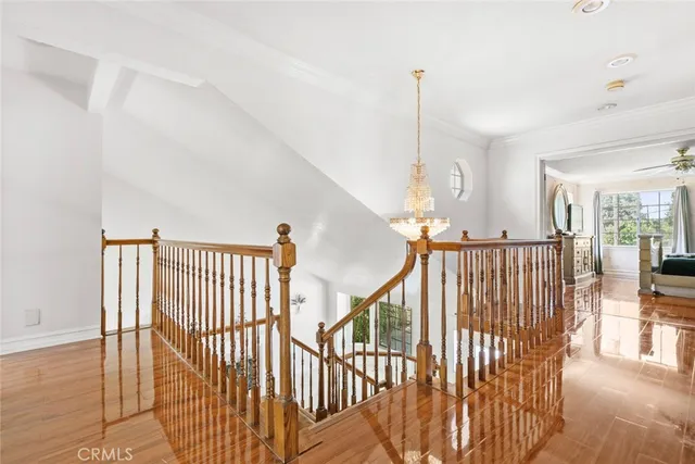 a view of hallway with wooden floor