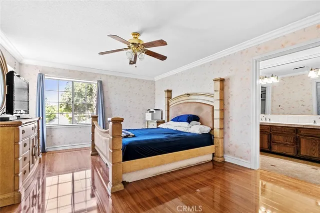 a spacious bathroom with a double vanity sink a mirror and a