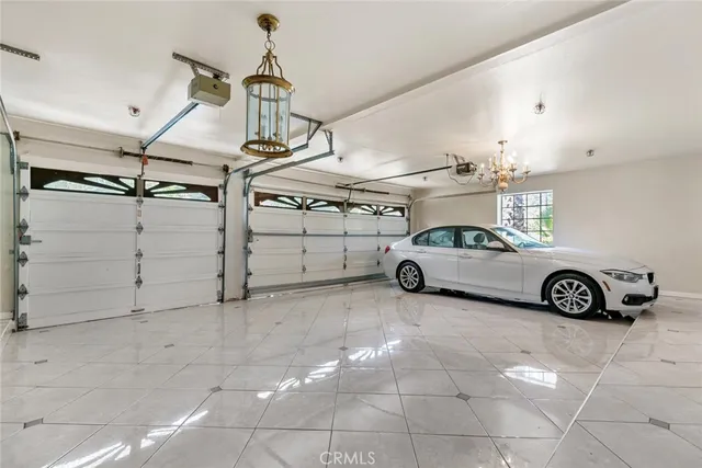 a view of a swimming pool with lawn chairs under an umbrella