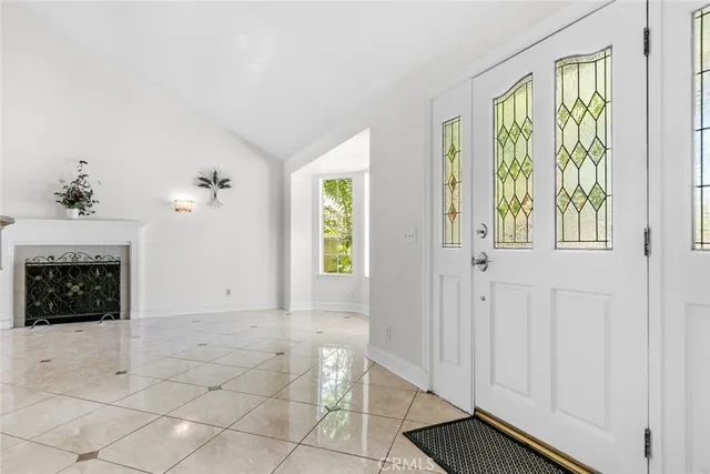 a view of a livingroom with an empty space and a fireplace