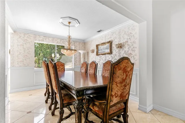 a view of a dining room with furniture and window
