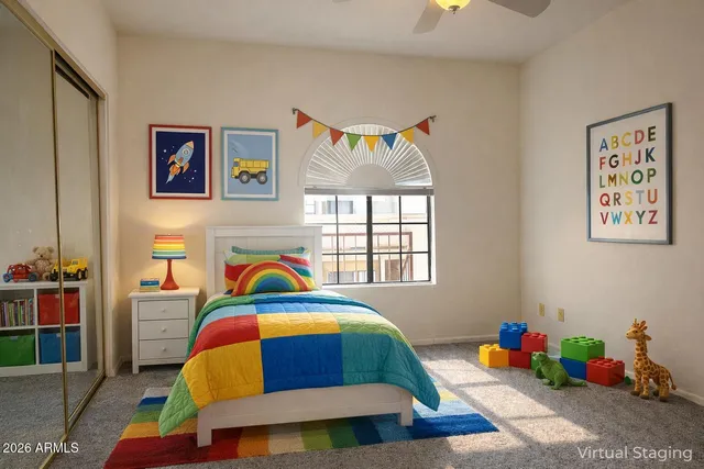 a bedroom with a bed and a window