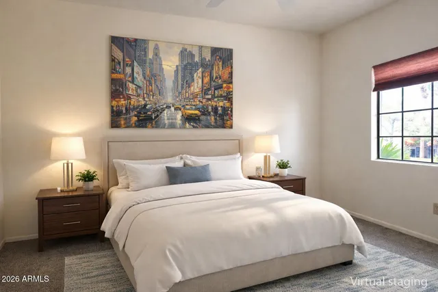 a bedroom with a bed and a window