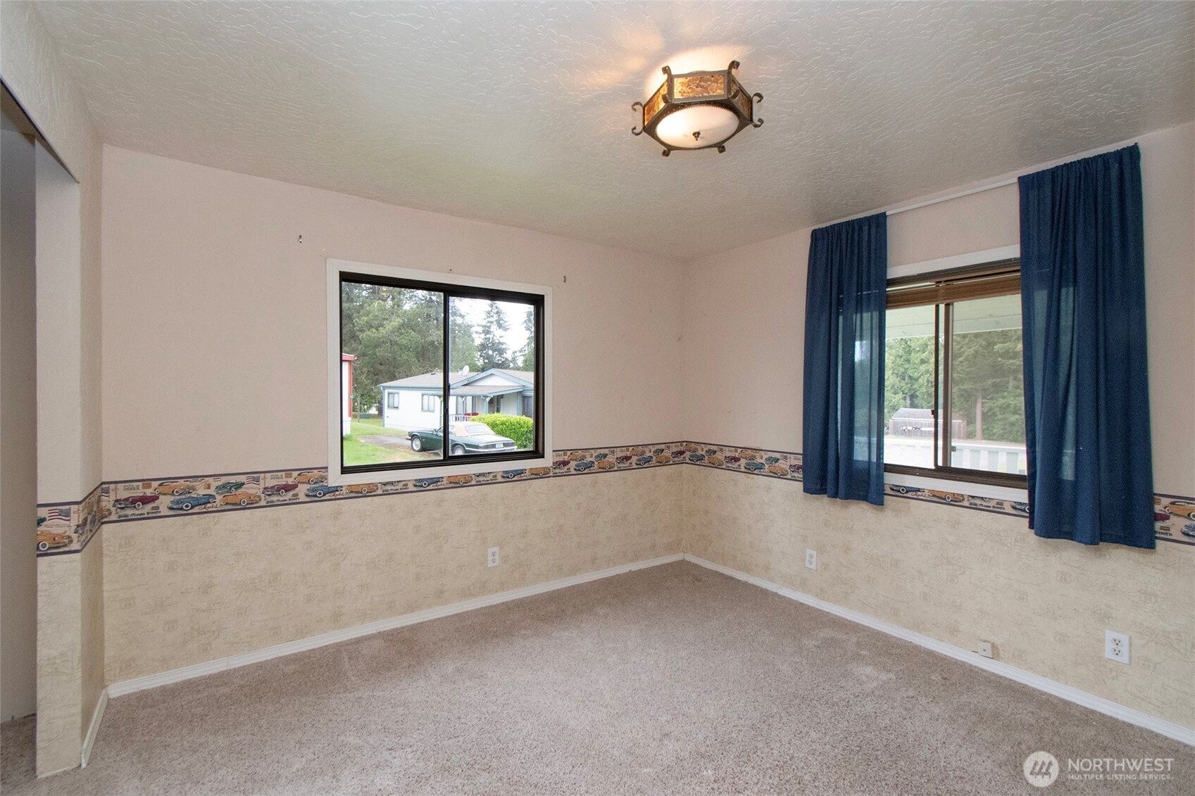 90 Baywood Village Road, Unit 34 Sequim, WA 98382 - Photo 20 of 40 wooden floor in an empty room with a window