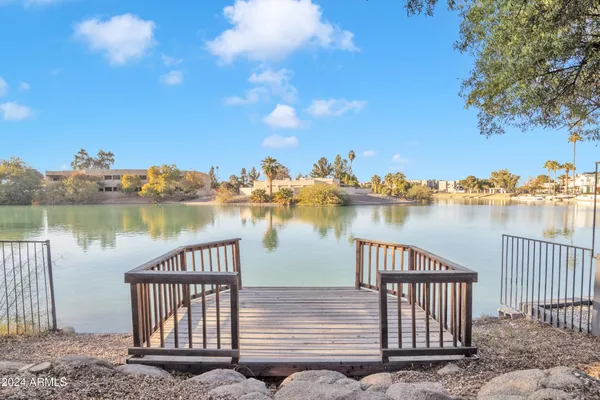 a view of a lake with a house in the background