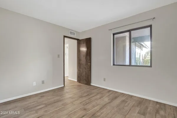 a view of an empty room with shelves