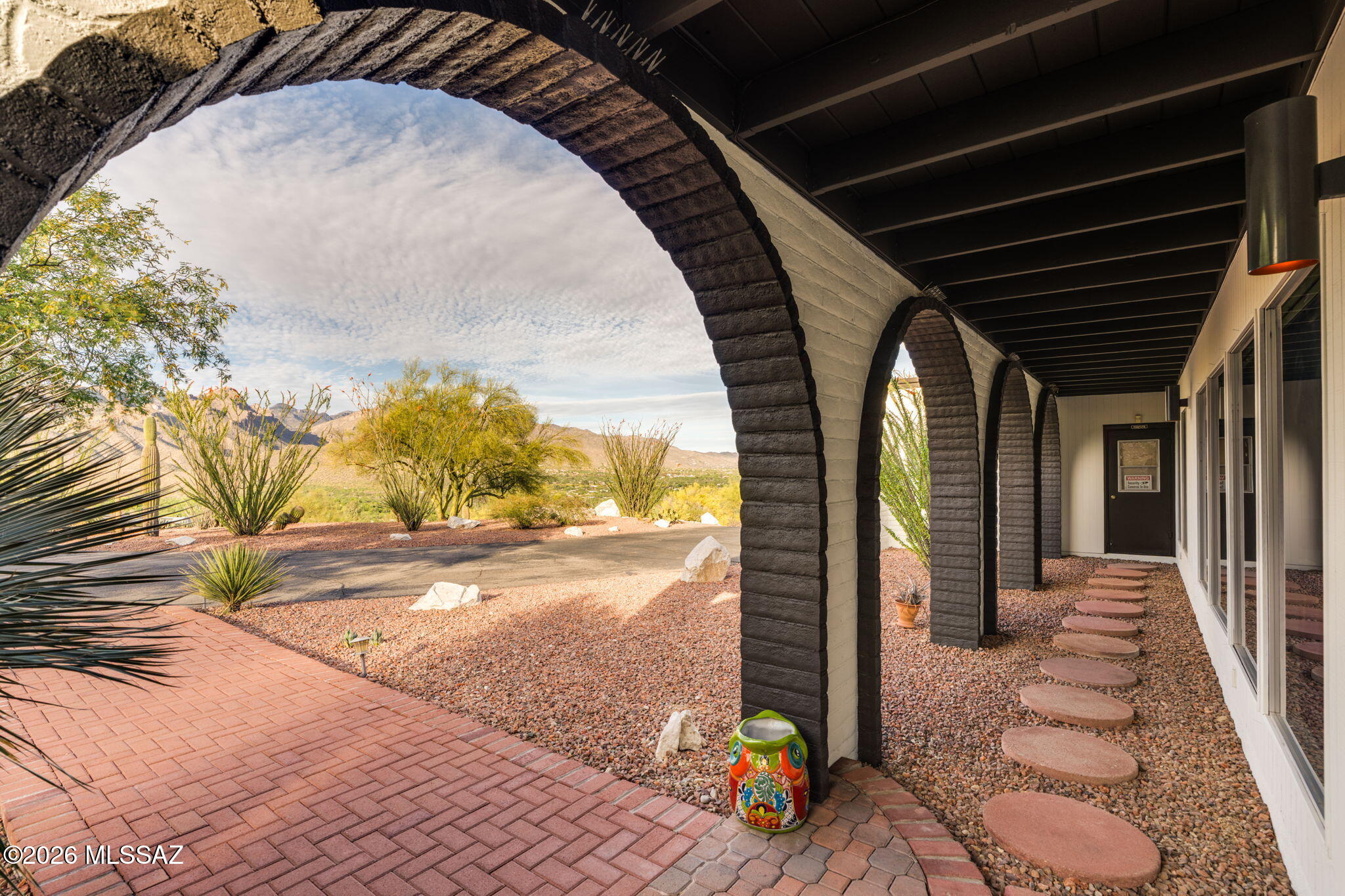 4641 North Rockcliff Road Tucson, AZ 85750 - Photo 6 of 48 Front of House under arched porch, beauty framed