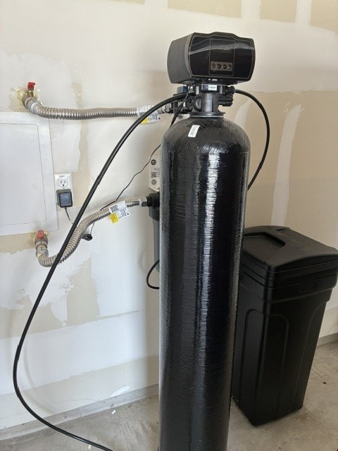 233 Perfect World Loop Jarrell, TX 76537 - Photo 22 of 24 Essential water softener system ensures premium water quality throughout the home.