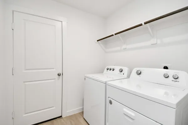 a bathroom with a glass shower door and sink