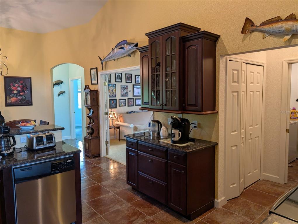 8511 Austrian Boulevard Punta Gorda, FL 33982 - Photo 12 of 20 a kitchen with stainless steel appliances granite countertop a stove and a refrigerator