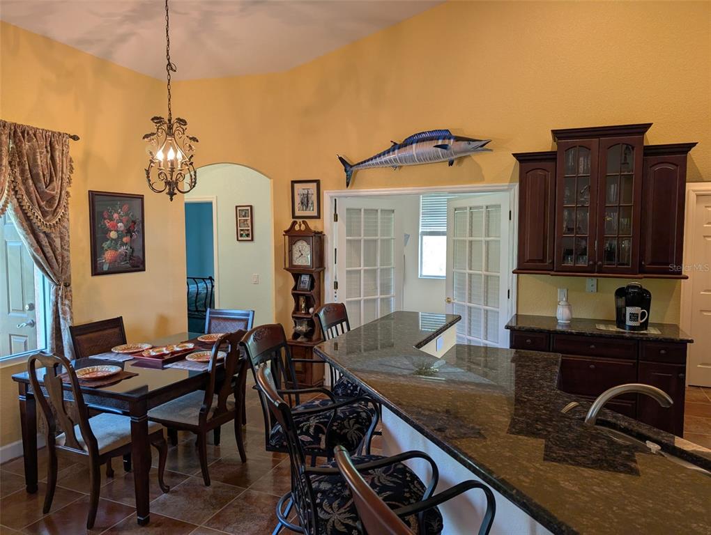 8511 Austrian Boulevard Punta Gorda, FL 33982 - Photo 13 of 20 a view of a a dining room with furniture window and wooden floor