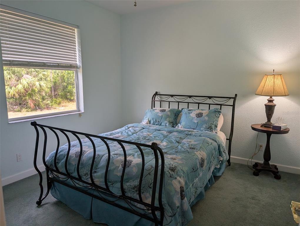 8511 Austrian Boulevard Punta Gorda, FL 33982 - Photo 18 of 20 a bedroom with a bed and a window