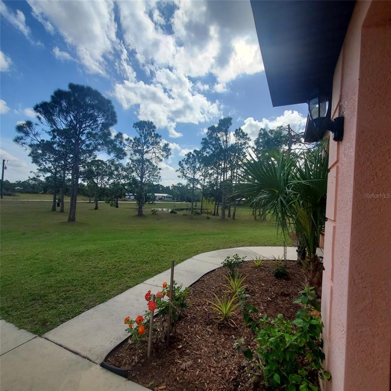 8511 Austrian Boulevard Punta Gorda, FL 33982 - Photo 4 of 20 a view of a garden with a fountain