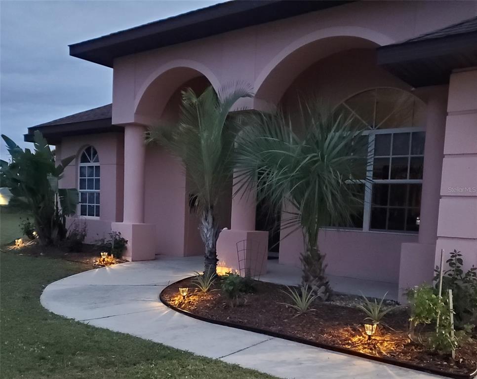 8511 Austrian Boulevard Punta Gorda, FL 33982 - Photo 5 of 20 a house view with a garden space