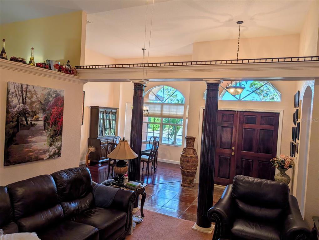 8511 Austrian Boulevard Punta Gorda, FL 33982 - Photo 8 of 20 a living room with furniture and a flat screen tv