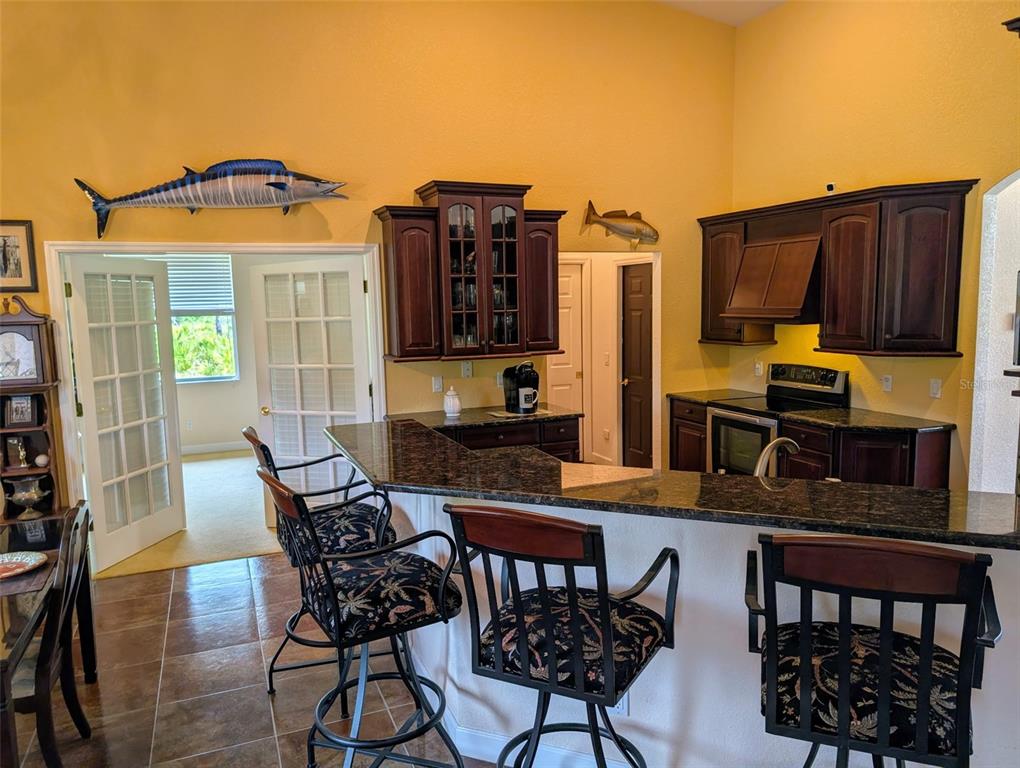 8511 Austrian Boulevard Punta Gorda, FL 33982 - Photo 9 of 20 a view of a dining room with furniture and chandelier